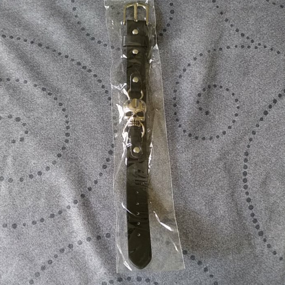 Black hand bracelet with skull